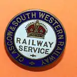 Round badge with a crown at the top, "RAILWAY SERVICE" in the centre, and "GLASGOW & SOUTH WESTERN RAILWAY" around the edge on a dark blue background.